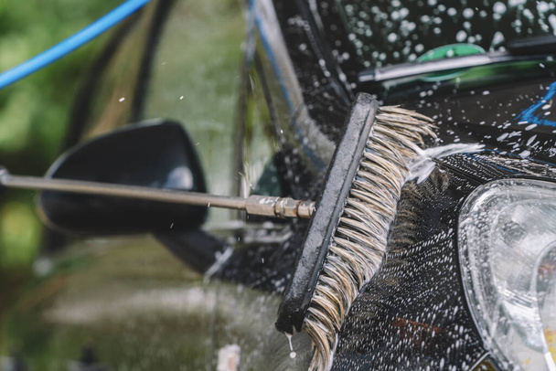 detail of cleaning brush on car at carwash - Φωτογραφία, εικόνα
