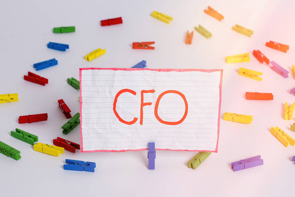 Conceptual hand writing showing Cfo. Business photo text chief financial officer managing the financial actions of company Colored clothespin papers empty reminder white floor office. - Photo, Image