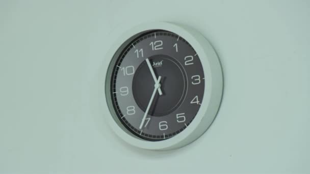 Zoom in of electric clock on white wall in empty office - Footage, Video