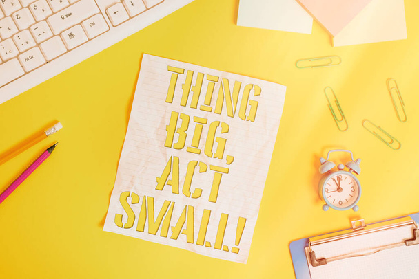 Conceptual hand writing showing Thing Big, Act Small. Business photo text Starts at a short term to reach a lifelong goals Flat lay above copy space on the white crumpled paper. - Photo, Image