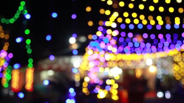 Θολή φόντο αφηρημένη Bokeh ματιά στα φώτα των Χριστουγέννων και της Πρωτοχρονιάς . - Πλάνα, βίντεο