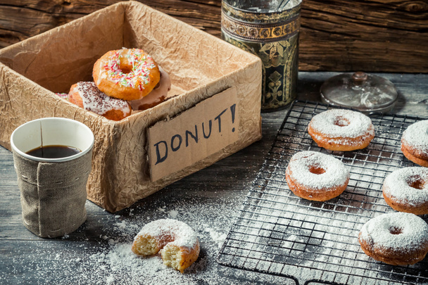 Tasting sweet donuts with powder sugar - Foto, Imagem