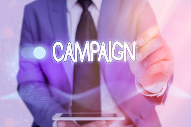 Writing note showing Campaign. Business photo showcasing series of activities meant to produce a particular result. - Photo, Image