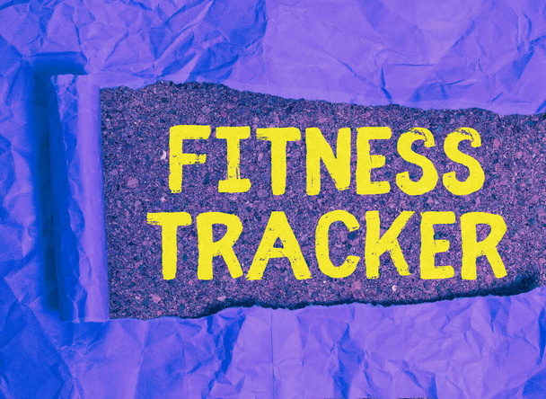 Text sign showing Fitness Tracker. Conceptual photo a monitoring device that records any healthrelated activity. - Photo, Image