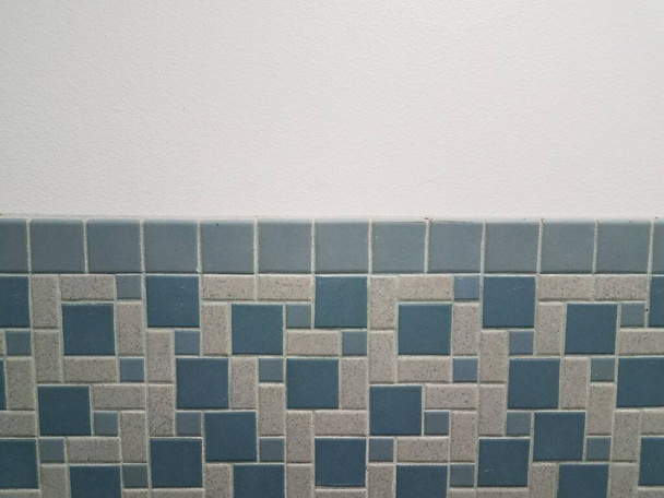 blue rectangle and square tiles on white bathroom wall - Fotó, kép