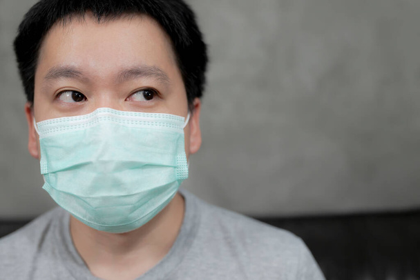 Man wearing hygienic mask to prevent infection, airborne respiratory illness such as flu, 2019-nCoV.Protection against contagious disease, coronavirus. - Photo, Image