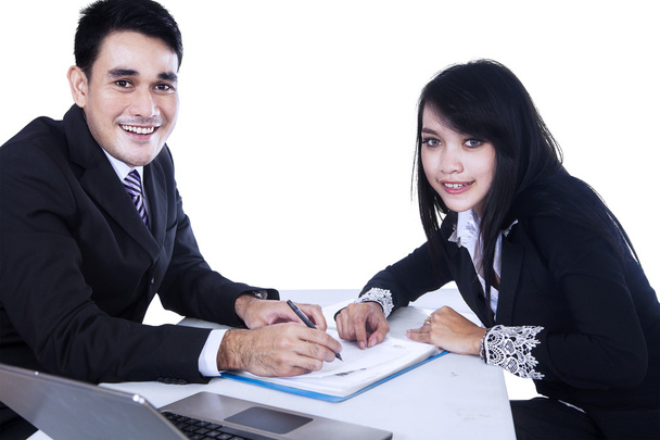 Happy businesspeople signing business contract - Photo, image