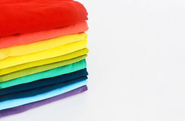 stack of colorful t-shirt on white background, copy space - Photo, Image
