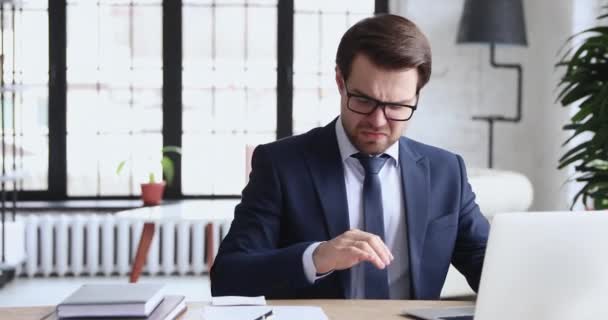 Unhappy 30s employee in formal suit suffering from runny nose. - Filmagem, Vídeo