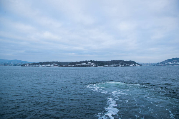 The cruise between the Islands Islands around Oslo Norway during the winter overlooking the sea and the Fjord - Photo, Image