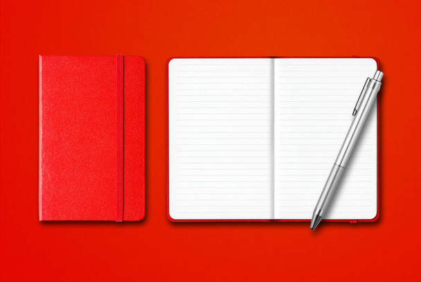 Red closed and open lined notebooks with a pen isolated on colorful background - Fotografie, Obrázek