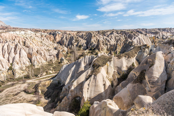 Red Valley and Rose Valley of Goreme of Nevsehir in Cappadocia, Turkey. Red Valley and Rose Valley Cappadocia get their name from the pinkish red-coloured rock   - Photo, Image