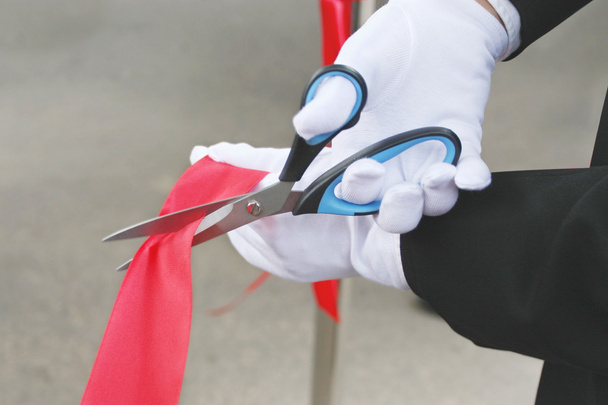Scissors cuts the red ribbon - Photo, image