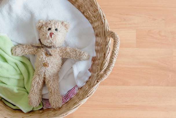 Teddy bear in a basket for washing in the morning - Φωτογραφία, εικόνα