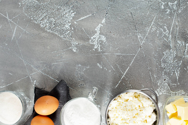 Fresh ingredients for baking, cottage cheese milk sugar eggs on a table - Фото, зображення