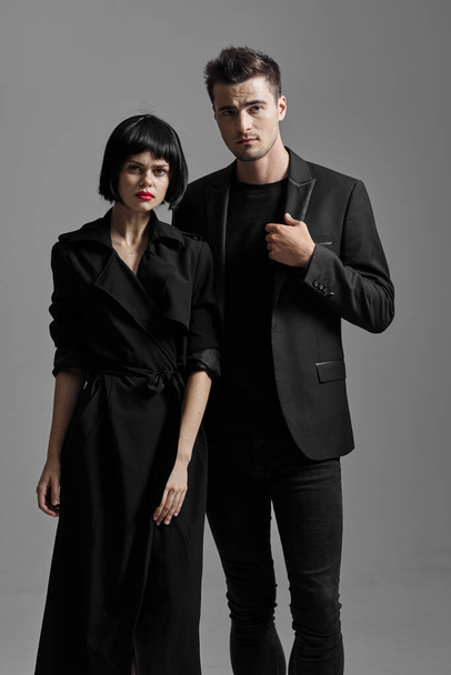 Young beautiful couple in black posing in studio - Foto, immagini