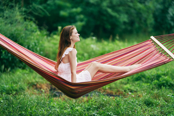 Young beautiful woman relaxing in hammock - Zdjęcie, obraz