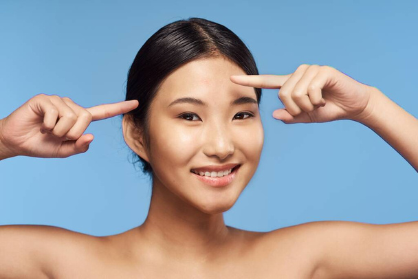 Young beautiful asian  woman with acne. Studio shot  - Foto, imagen
