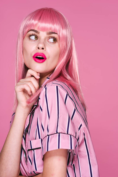 young beautiful woman in pink wig  posing in studio  - Valokuva, kuva