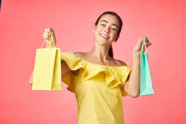  young woman  with shopping bags in studio - Photo, Image