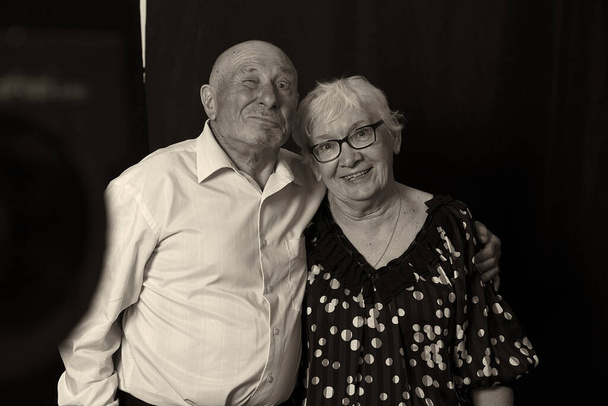 Portrait of senior elderly couple demonstrate their true love to each other, have good relationships, experienced many positive and negative events in life together, being inseparable and supportive. - Photo, Image