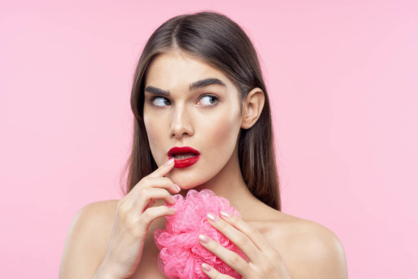 Skincare and beauty. Portrait of young beautiful woman with washcloth on pink background - Fotoğraf, Görsel