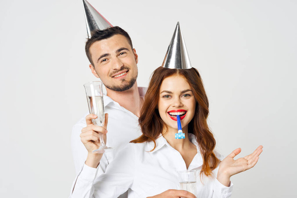 portrait of young beautiful couple celebrating birthday  with champagne - 写真・画像