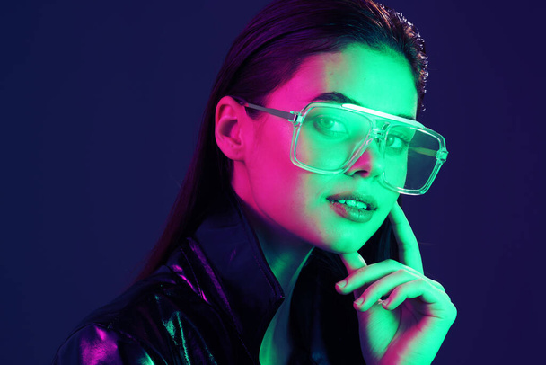 young beautiful fashion woman  in glasses posing in studio - 写真・画像