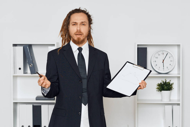 Young businessman with document in the office  - Foto, Imagen