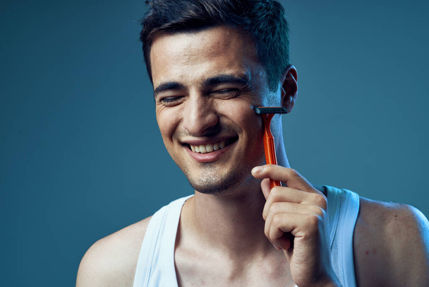 young handsome man shaving - Photo, Image