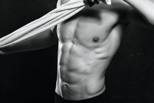 Studio shot. male bodybuilder, nude athlete with towel - Foto, Bild