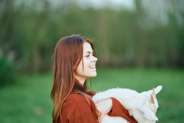woman with cute  little baby goat on the farm - Foto, Imagem