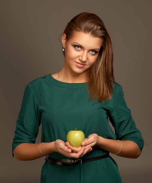 Woman with apple - Фото, изображение