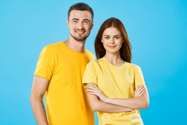 young beautiful couple posing in studio on isolated background - Foto, Imagen