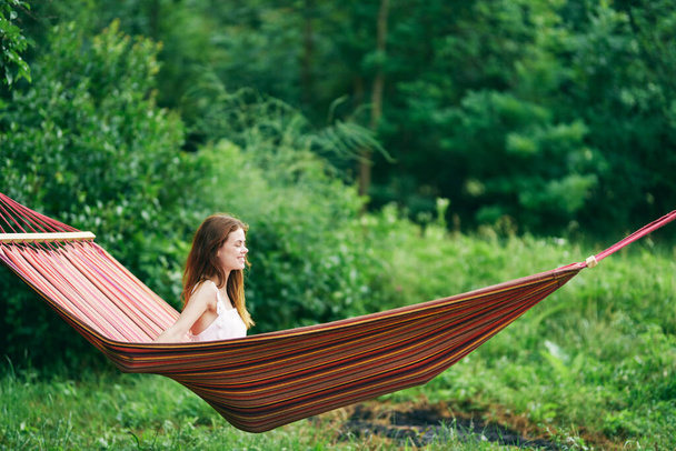 Young beautiful woman relaxing in hammock  - Fotografie, Obrázek