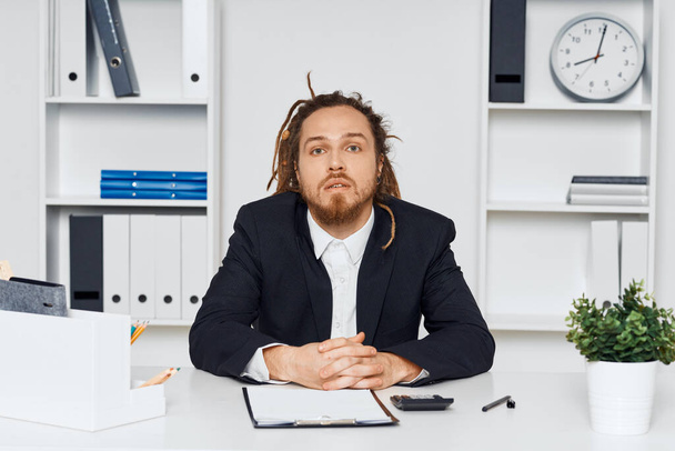 Young businessman sitting in the office  - Photo, image