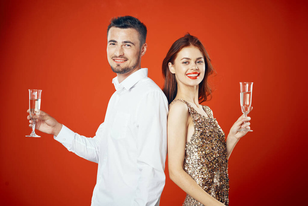 portrait of young beautiful couple celebrating New Year with champagne - Photo, Image