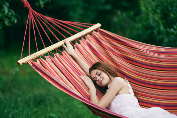 Young beautiful woman relaxing in hammock  - Fotó, kép