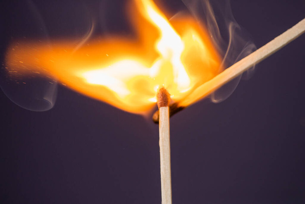 Close up Macro shot of a ignition match on a second match captured in super slow motion - Photo, Image