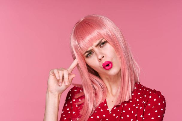 young beautiful woman in pink wig  posing in studio  - Foto, afbeelding