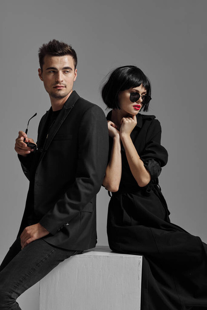 Young beautiful couple in black posing in studio - Zdjęcie, obraz