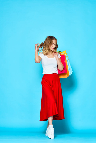  Young beautiful woman  with bags   in studio              - Photo, Image