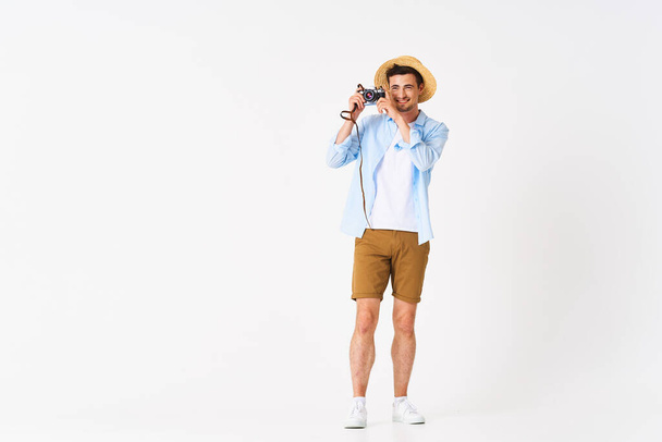 young handsome man tourist with camera in studio - Photo, Image