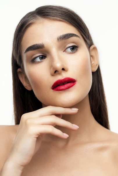 Portrait of young beautiful woman with  red lipstick on her lips. Beauty, fashion photography  - Photo, image