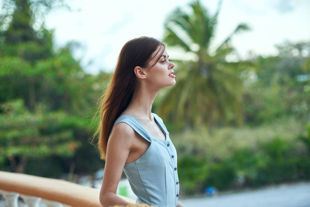   Young beautiful woman posing on tropical resort  - Foto, Imagen