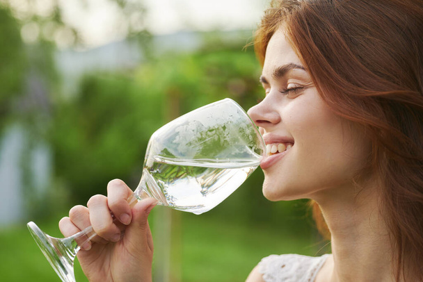 Young beautiful woman drinking wine  - Foto, imagen
