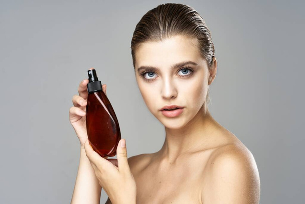 Young woman with beauty product - Foto, Imagem