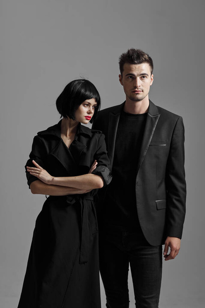 Young beautiful couple in black posing in studio - Foto, immagini