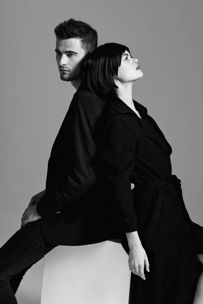 Young beautiful couple posing in studio. Black and white.    - Photo, Image