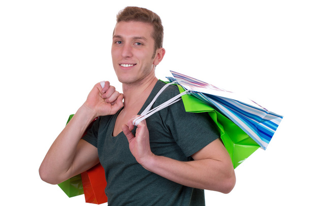 Young man buying with shopping bags - Foto, Imagem